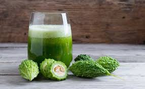 Fresh Karela (bitter gourd) with a glass of green juice